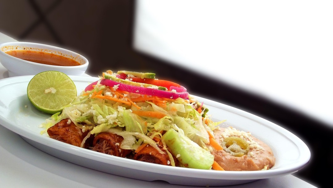 Loaded nachos with guacamole at Nacho Bell